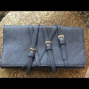 BCBG grey clutch with gold buckle strap design